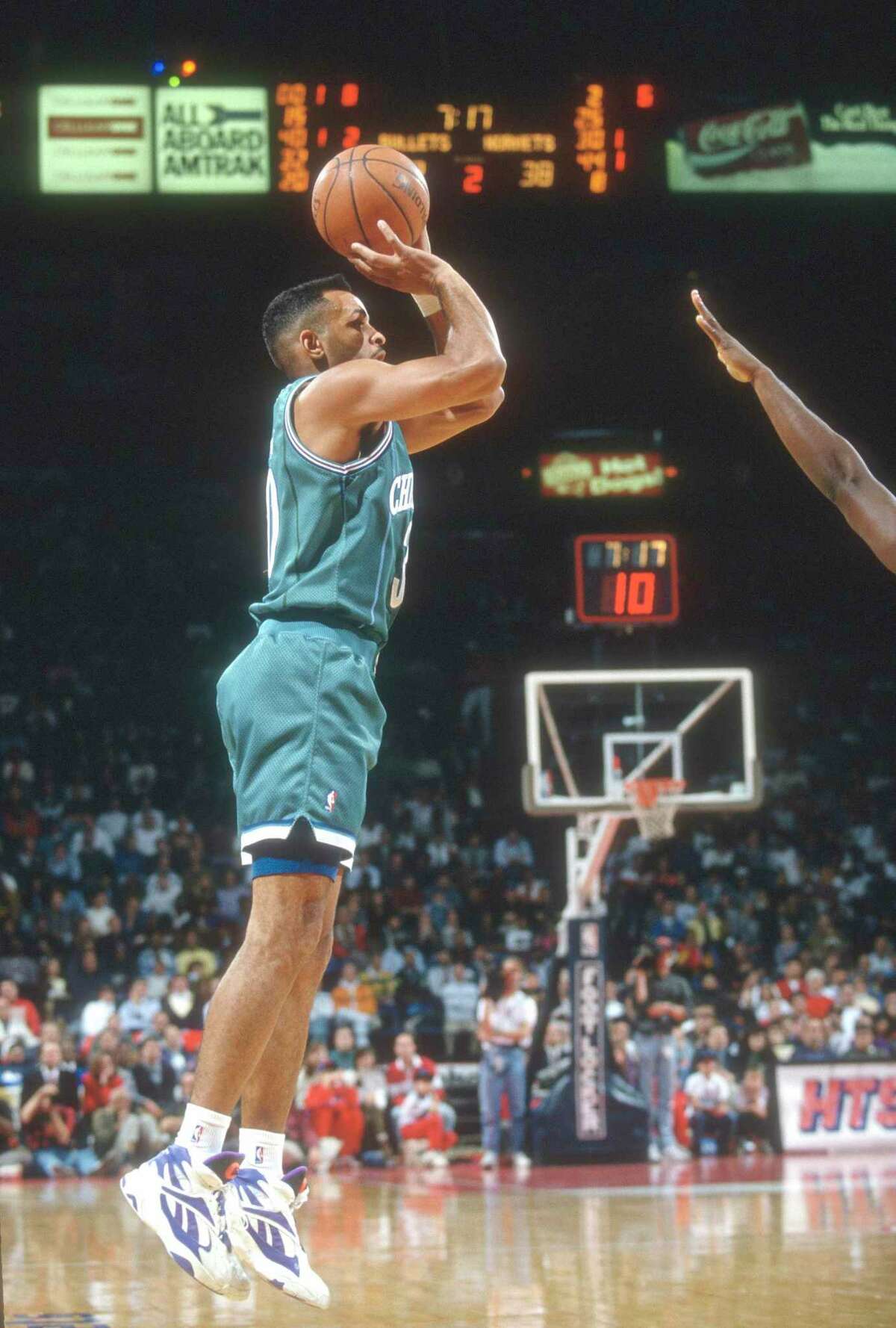 LANDOVER, MD - CIRCA 1994: Dell Curry #30 of the Charlotte Hornets shoots against the Washington Bullets during an NBA basketball game circa 1994 at the US Airways Arena in Landover, Maryland. Curry played for the Hornets from 1988-98. (Photo by Focus on Sport/Getty Images) *** Local Caption *** Dell Curry