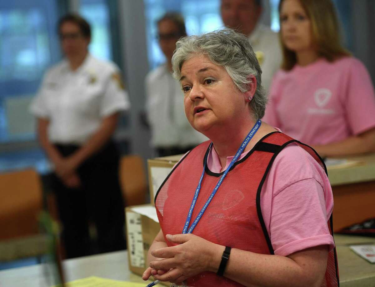 Stratford Health Director Andrea Boissevain leads a mock press conference during a multiple town drill for the mass dispersing of medication at Trumbull High School in Trumbull, Conn. on Tuesday, June 25, 2019. The drill, featuring Medical Reserve Corps volunteers from Trumbull, Stratford, and Monroe, simulated the dispensing of antibiotics in response to an anthrax incident on a Metro North train.