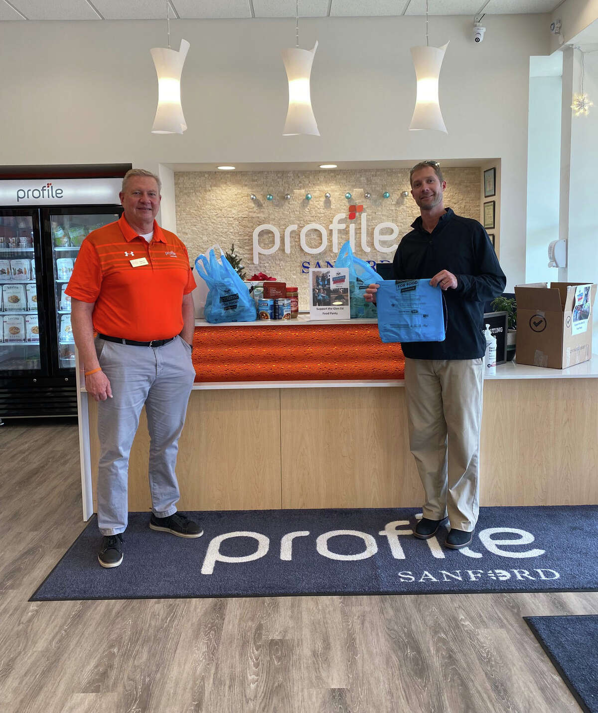 Kevin Hill, local owner of Profile in Glen Carbon (Left) with Kevin Buhr, District Director of Madison and Bond counties for the Greater St. Louis Area Council of the Boy Scouts of America (Right).
