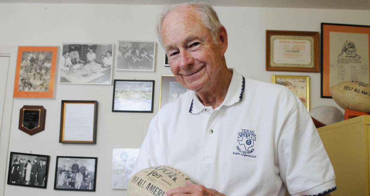 Legendary sportswriter Dave Campbell holds a football at his home after announcing his retirement from writing June 6, 2008 in Waco Texas. (AP Photo/Waco Tribune Herald, Rod Aydelotte)