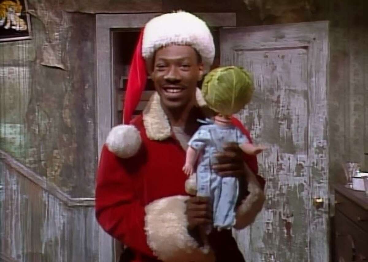 Mister Robinson's Neighborhood: Christmas Eddie Murphy plays Mister Robinson, a parody of goody-two-shoes Mister Rogers. This well-loved character shows us what Christmas looks like in his neighborhood, even comparing himself to Santa because they both like to “sneak into your house late at night.” Robinson uses a Salvation Army bucket as a small business opportunity and tries to sell a homemade version of the 1980s hit present, the Cabbage Patch Kid. To make his version of the toy that parents brawled over, Murphy pulls off the head of a doll and inserts some stolen cabbage in its place.