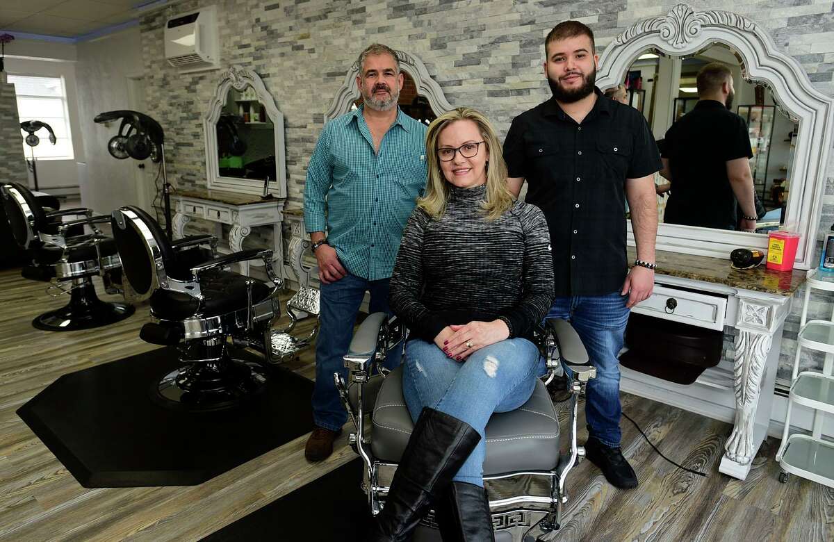 The Hidden Gem owner Edilma Bonilla and her husband Guillermo Bonilla, and son Sebastian Bonilla at their new salon at the former Ralph and Augie's location December 10, 2021, in Westport, Conn. The Hidden Gem is a new female owned crystal shop/full service hair salon and barbershop