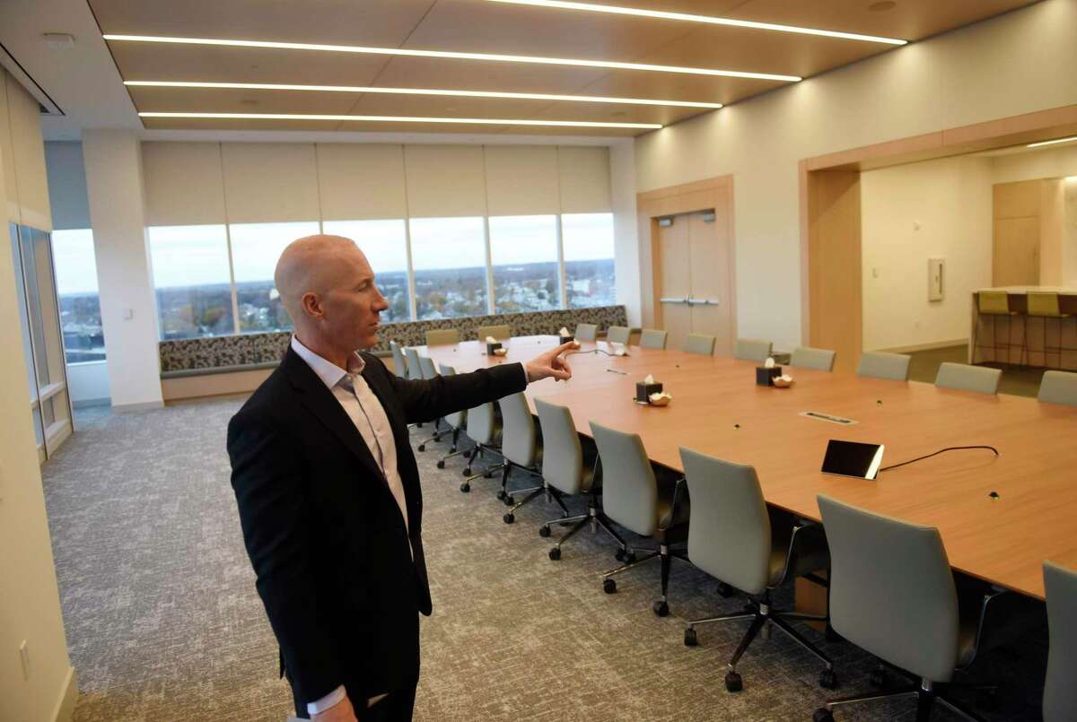 Charter Senior Vice President of Corporate Services Mike Reid shows the 14th floor board room in the new Charter Communications headquarters at 400 Washington Blvd. in Stamford, Conn., on Wednesday, Nov. 17, 2021. The telecommunications company's new headquarters at 400 Washington Blvd. features Class A office space inside a 14-story structure and adjoining nine-story structure, which is still under construction.
