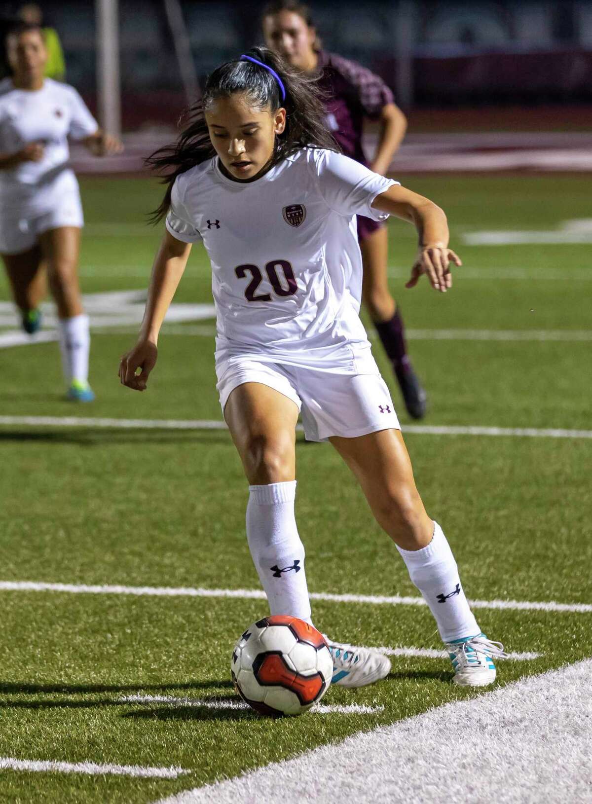 Magnolia West soccer player Karina Sosa (20) drives the ball in a 19-5A match against Magnolia high school in Magnolia, Tuesday, Feb. 4 , 2020.