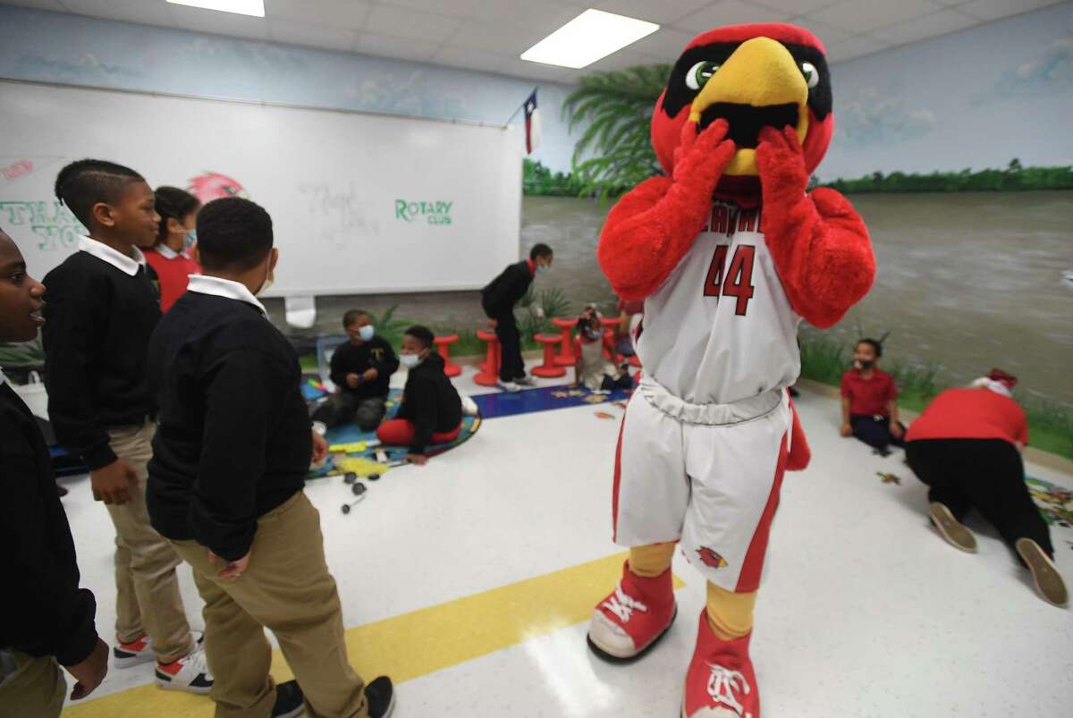 Big Red reacts after getting a first glimpse of the new nest during the grand opening of the Cardinal Nest at Martin Elementary School. The nest was dedicated in honor of Kenneth Lamar Haynes, Jr., a student at Martin who passed away in 2017. Photo made Thursday, December 9, 2021 Kim Brent/The Enterprise