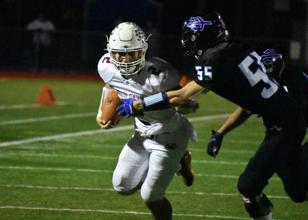 Bristol Central’s Victor Rosa breaks a tackle during a football game against Plainville in November.