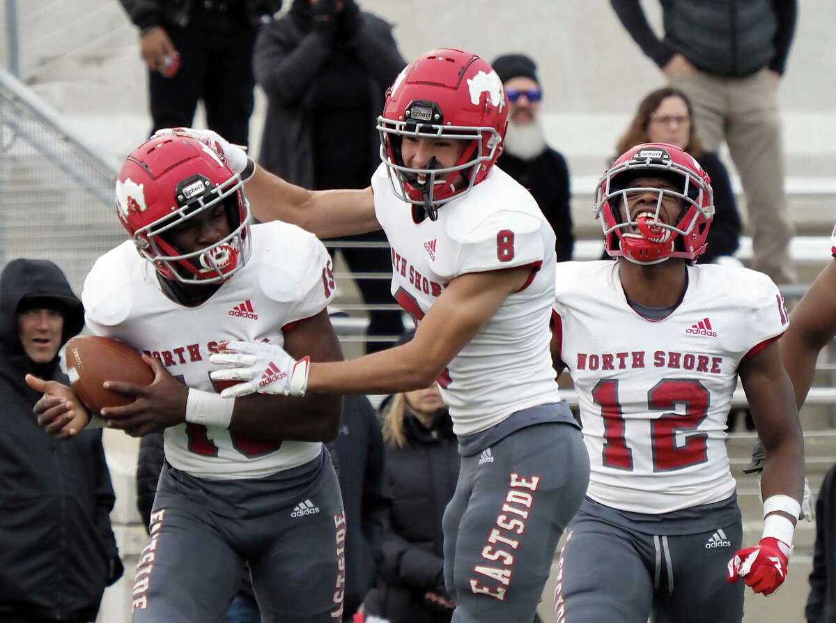 Dec. 11, 2021; Austin, Texas, USA; North Shore Mustangs Kaleb Bailey (15) and David Amador (8) and Jhalyn Bailey (12) react after a touchdown against the Lake Travis Cavaliers during the second quarter of the Class 6A Division I state semifinal game at Reeves Stadium in Austin on Saturday.