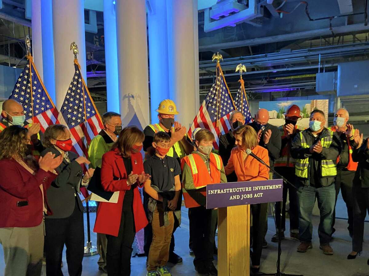 Speaker of the House Nancy Pelosi discusses how funds from the new bipartisan infrastructure act will affect the Bay Area. Youngsters were gathered on the stage to represent the workforce of the future who will build and benefit from new transit.