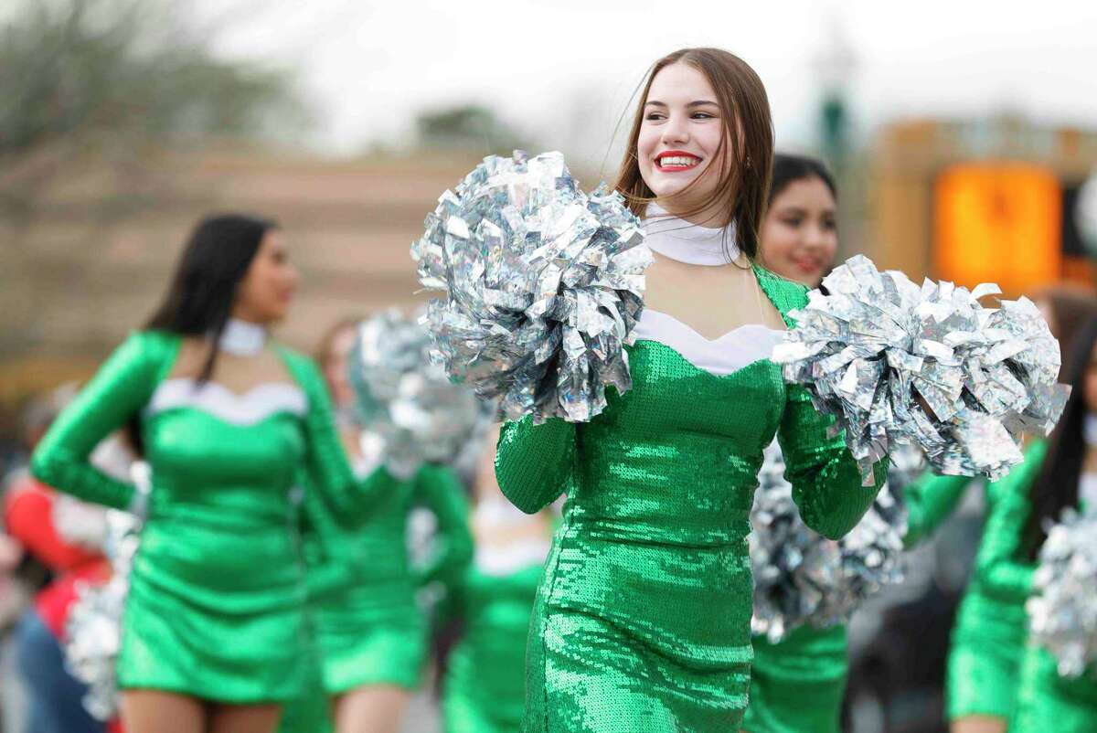 Members of the Conroe High School Golden Girls dance team performs during the annual Conroe Christmas parade, Saturday, Dec. 11, 2021, in Conroe.