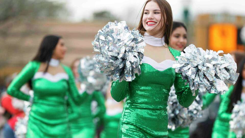 Members of the Conroe High School Golden Girls dance team performs during the annual Conroe Christmas parade, Saturday, Dec. 11, 2021, in Conroe.