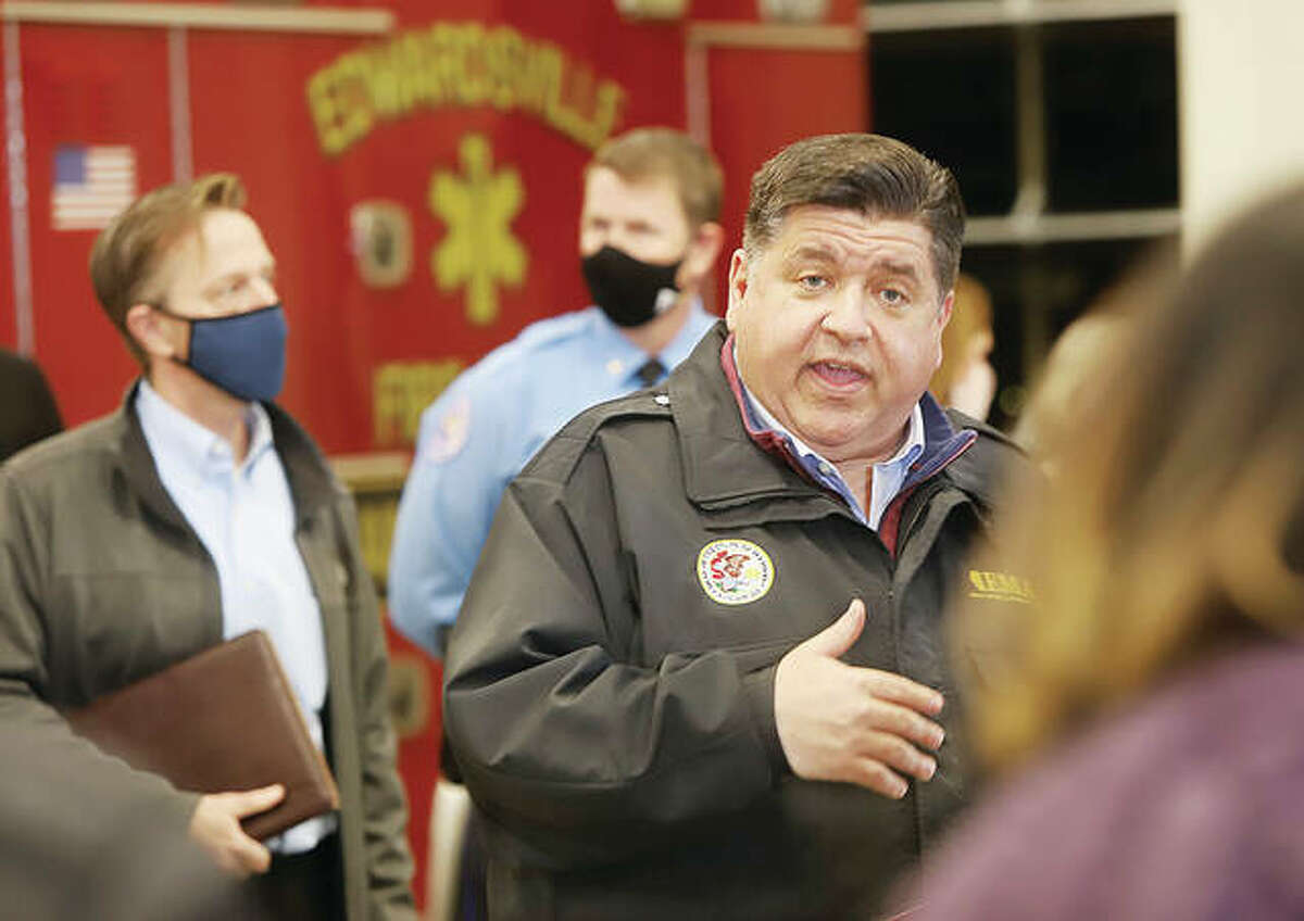 Gov. J.B. Pritzker talks at a press conference Saturday evening in Edwardsville Fire Station Number 1 following a storm that killed six people at an Amazon facility in Edwardsville. On Monday, he issued a disaster proclamation that included Madison County and 27 other counties receiving damage in Friday night's storms. 