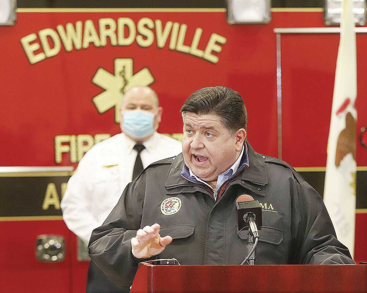 Gov. J.B. Pritzker talks at a press conference Saturday evening in Edwardsville where he announced that six people have died in the Friday night collapse at the Amazon warehouse. Edwardsville Fire Chief James Whiteford addressed. 