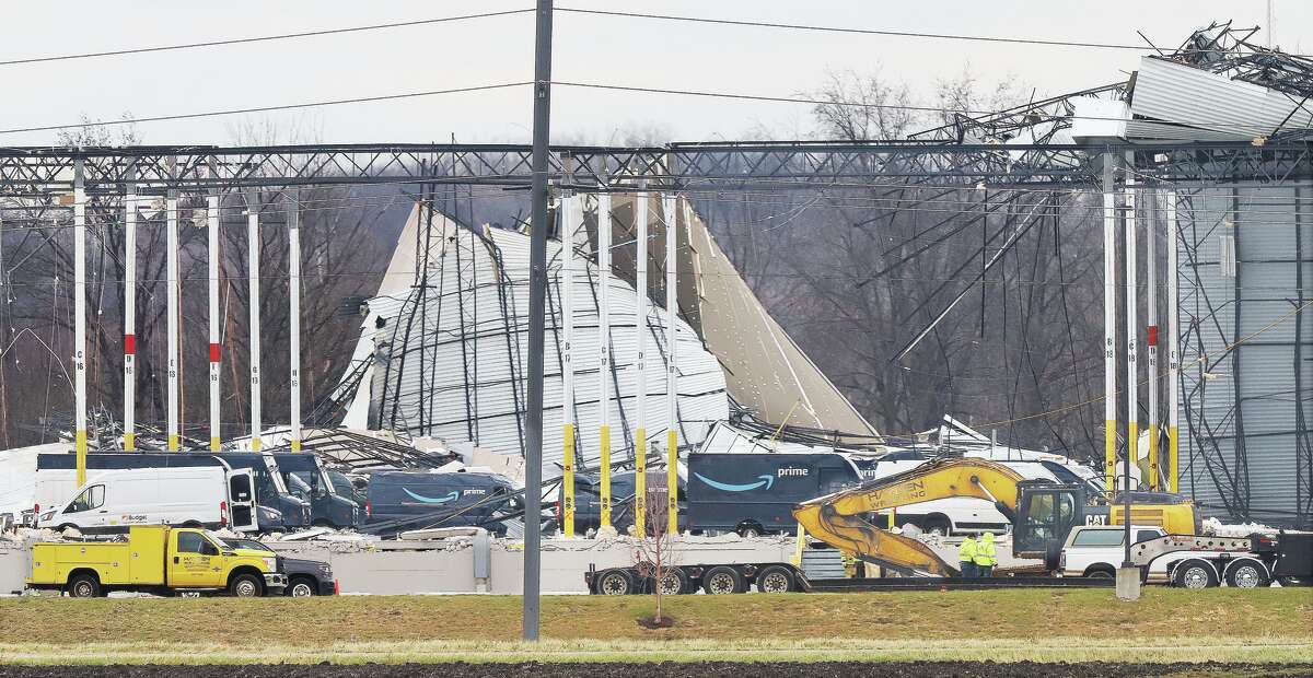 John Badman|The Telegraph Tornado damage to the west side of the Amazon facility in Edwardsville was evident Saturday. Late Saturday officials said six fatalities have been recorded in the building collapse Friday night,