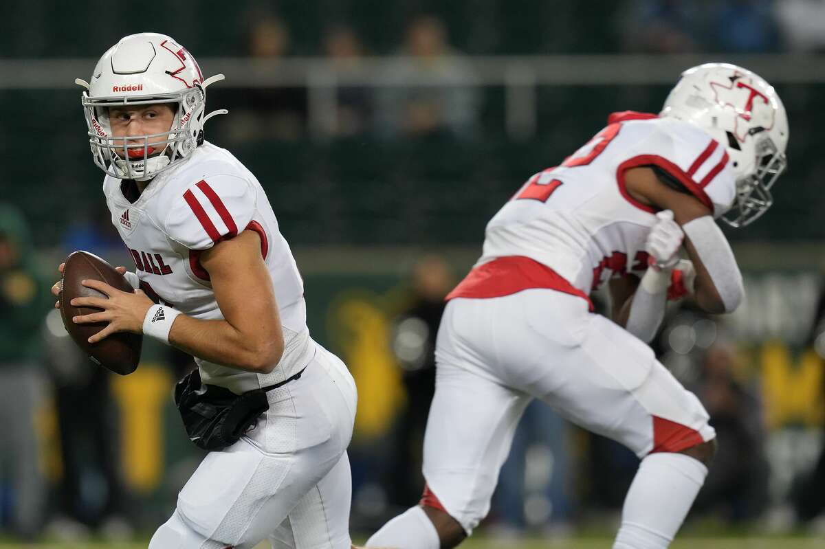 Tomball quarterback Cale Hellums (3) looks for a receiver during Class 6A Division II state semifinal against Denton Guyer at Baylor University's McLane Stadium in Waco on Saturday, Dec. 11, 2021.