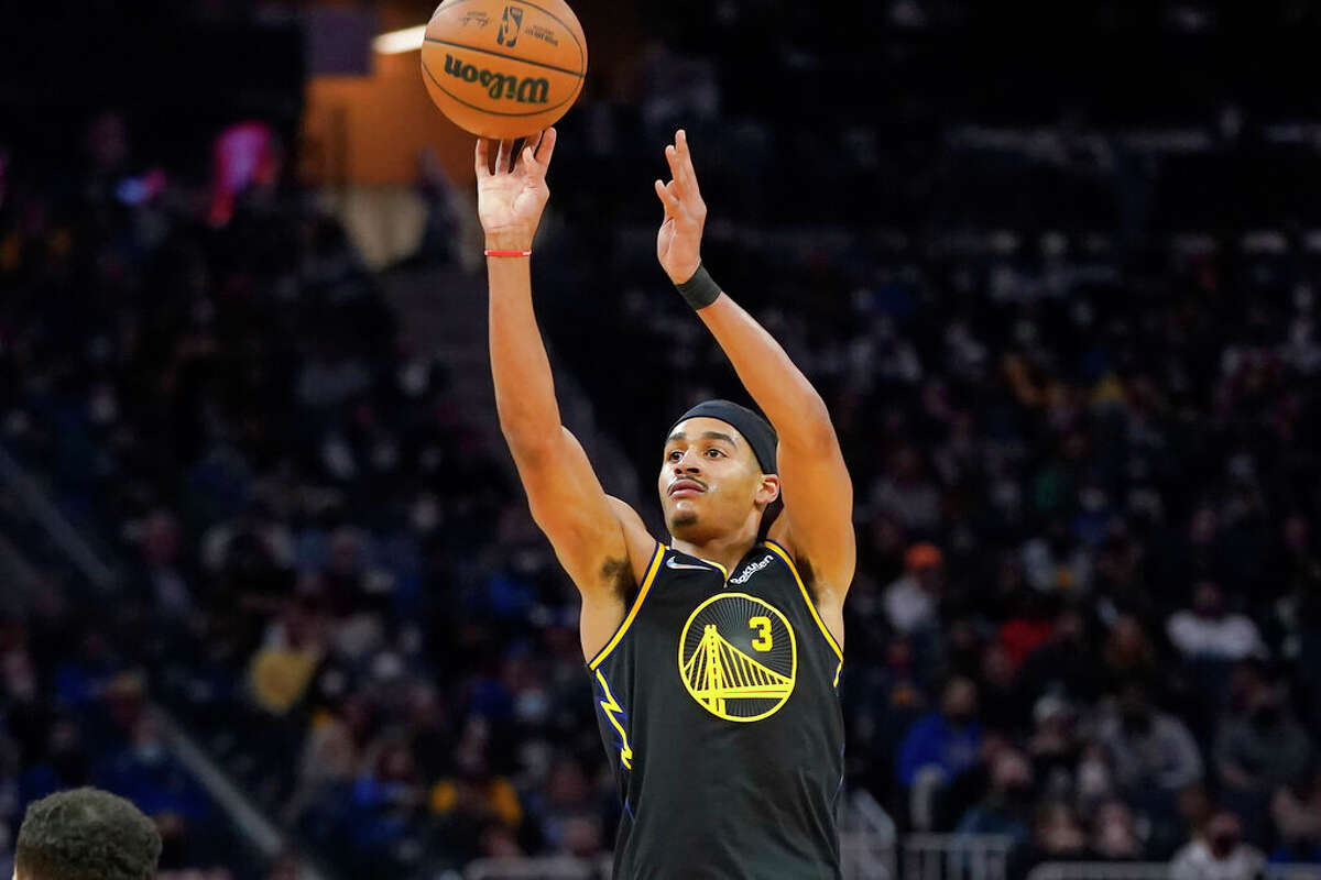 Golden State Warriors guard Jordan Poole shoots against the Portland Trail Blazers during the second half of an NBA basketball game in San Francisco, Wednesday, Dec. 8, 2021.