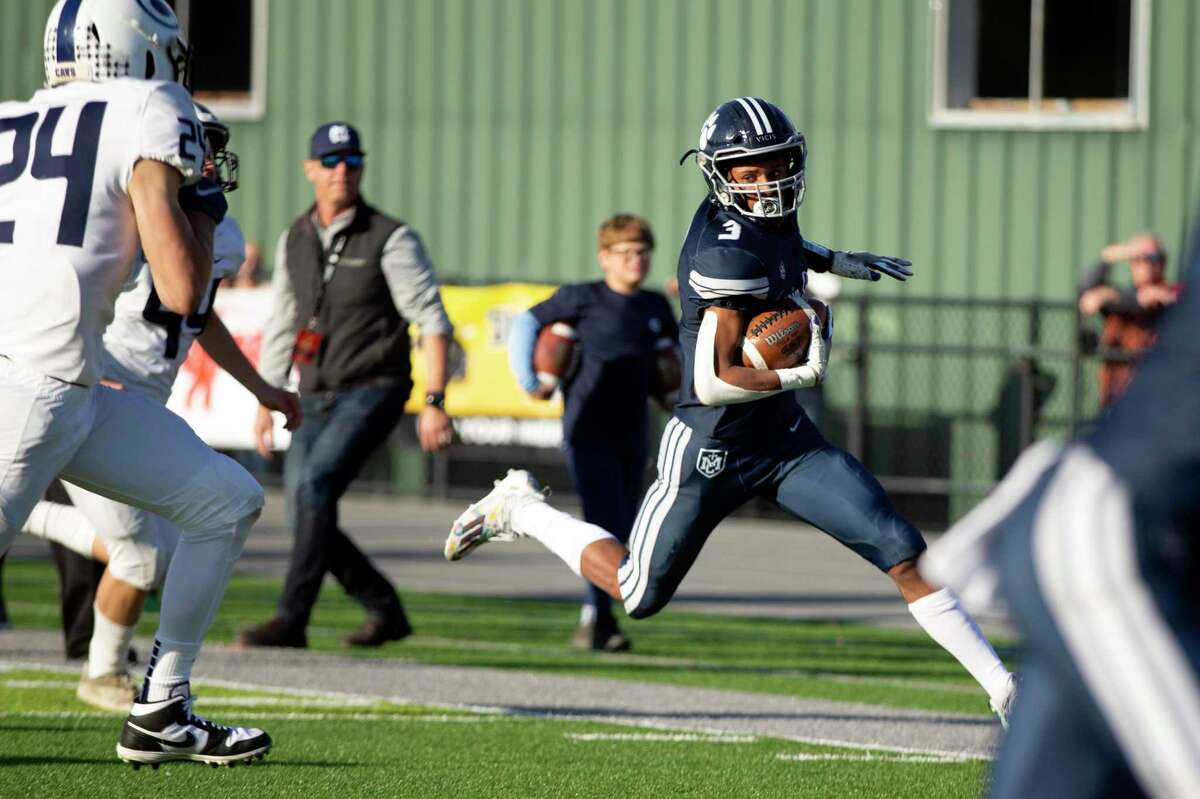 Marin Catholic running back Charles Williams (3) turns the corner toward the end zone as he scores a touchdown against Central Valley Christian during the third quarter of a CIF Division 4-AA high school football championship game on Saturday, Dec. 11, 2021 in Kentfield, Calif.