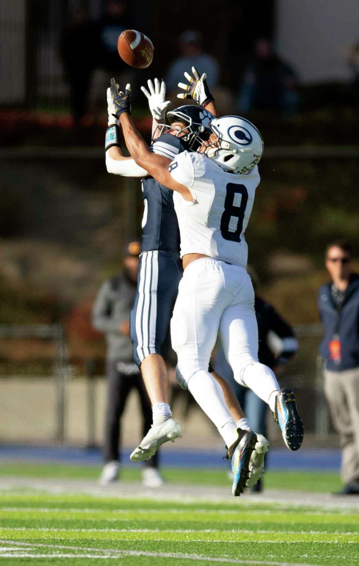 Marin Catholic defensive back Charlie Knapp, left, beats Central Valley Christian tight end Jaeden Moore (8) to the ball for an interception during the third quarter of a CIF Division 4-AA high school football championship game on Saturday, Dec. 11, 2021 in Kentfield, Calif.