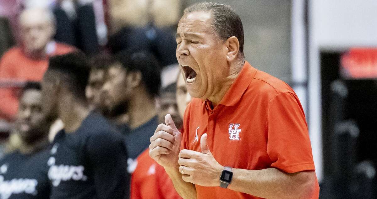 Houston head coach Kelvin Sampson yells in to his players during the second half of an NCAA college basketball game against Alabama, Saturday, Dec. 11, 2021, in Tuscaloosa, Ala. (AP Photo/Vasha Hunt)