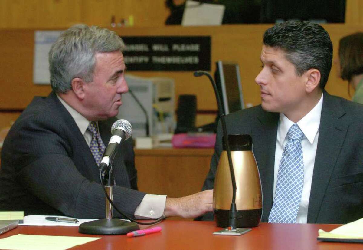 Lawyer Mickey Sherman, left, speaks to defendant Marash Gojcaj at the Superior Court in Danbury in this Sept., 15, 2010 file photo.