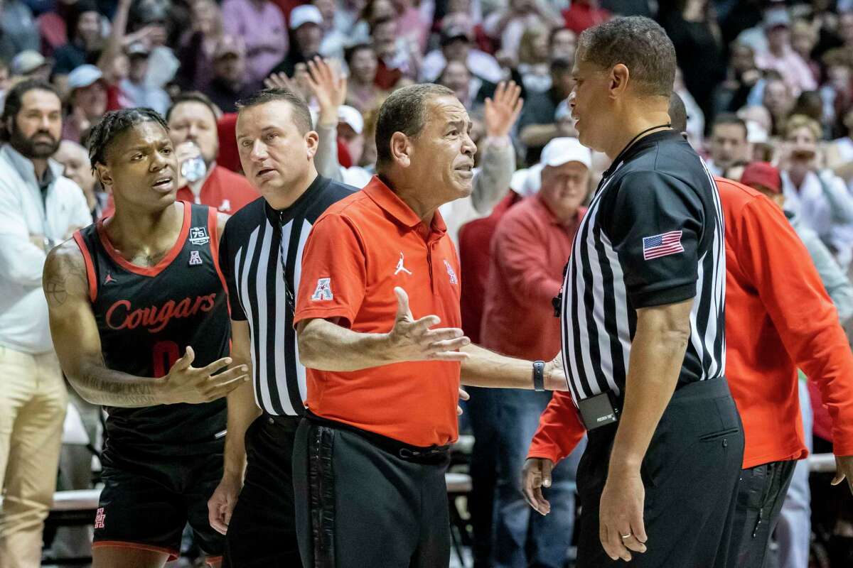 Houston guard Marcus Sasser (0) and Houston head coach Kelvin Sampson try to convince the refs not to leave the floor and to look at the final play for possible goaltending call after an NCAA college basketball game against Alabama, Saturday, Dec. 11, 2021, in Tuscaloosa, Ala. (AP Photo/Vasha Hunt)