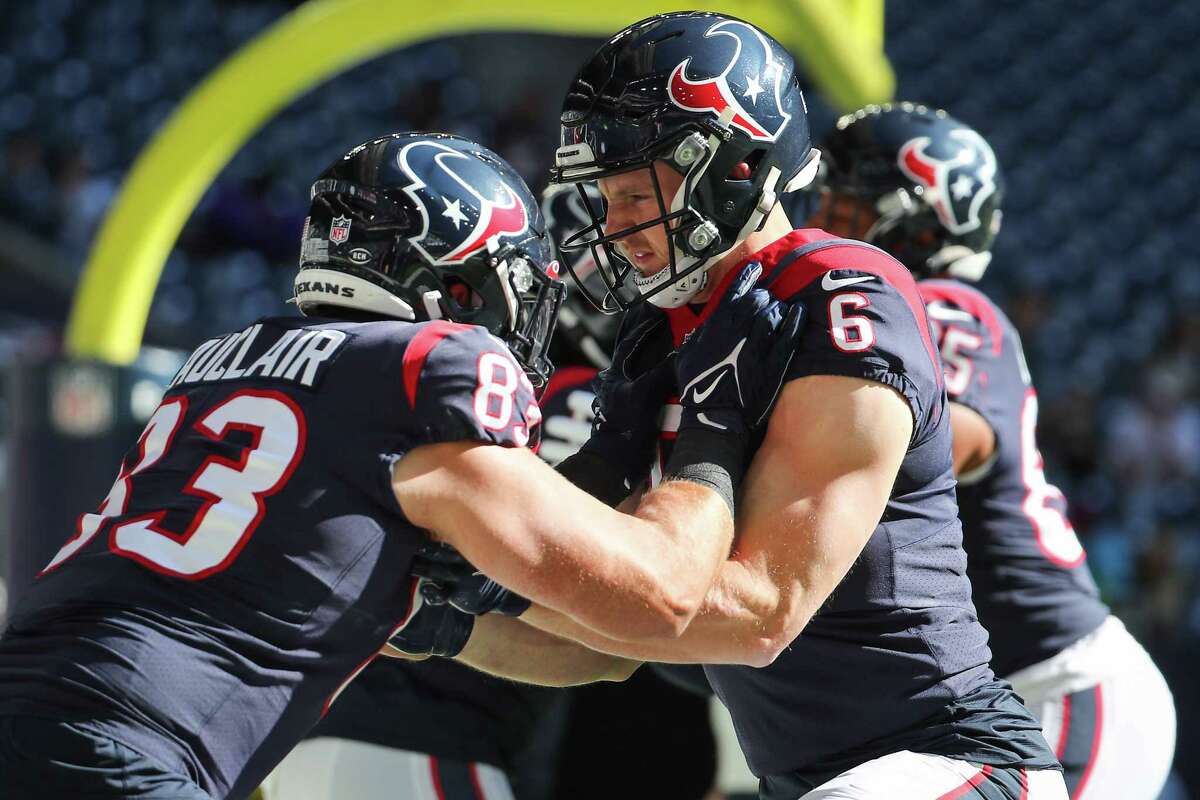 Houston Texans tight ends Antony Auclair (83) and quarterback Jeff Driskel (6) warm up before an NFL football game against the Seattle Seahawks Sunday, Dec. 12, 2021 in Houston. Driskel warmed up with the tight ends.