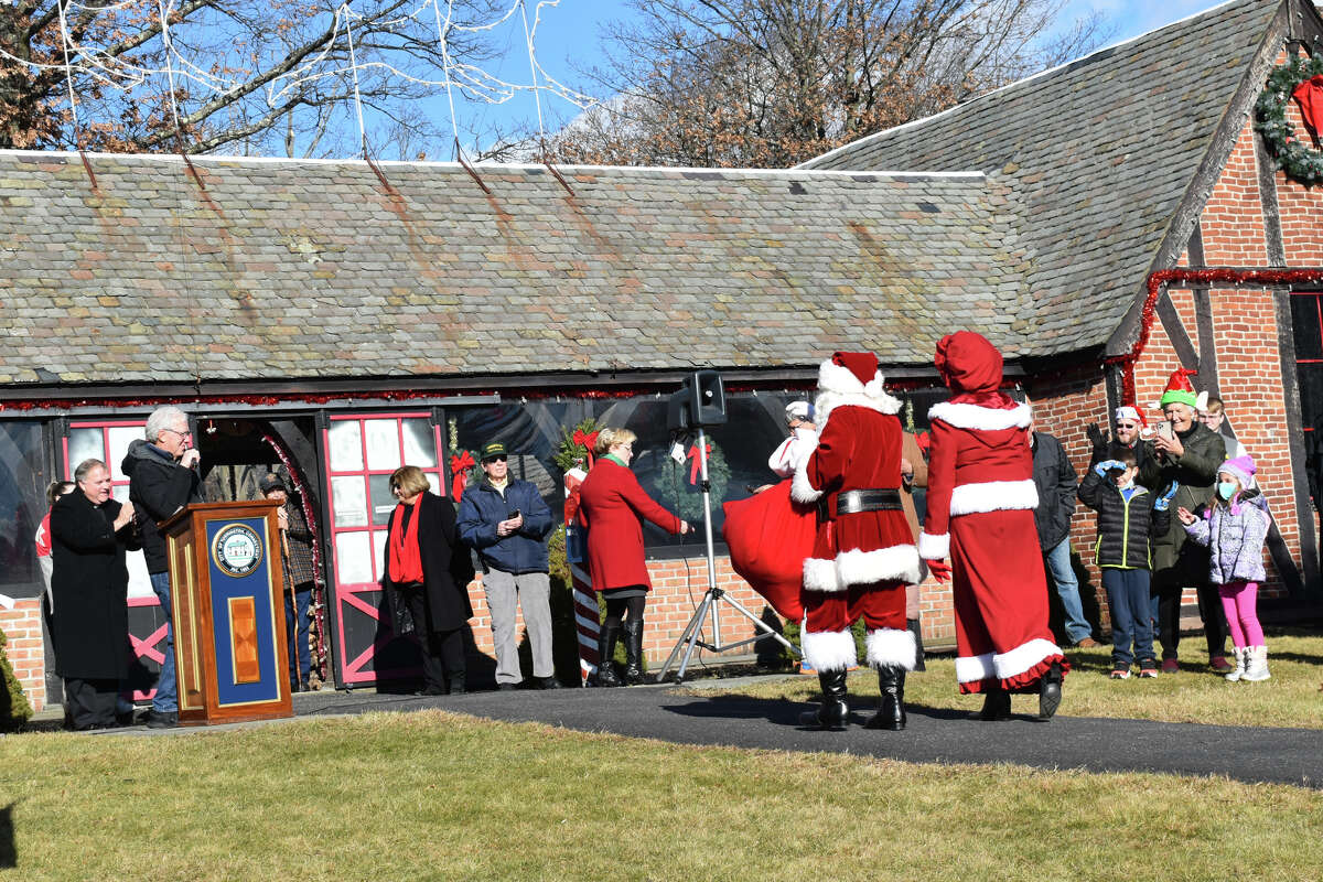 Santa, Mrs. Claus, three elves and four reindeer will be welcoming children and adults at Christmas Village Dec. 11-23 from 1-8:30 p.m. and Dec. 24 from 9 a.m.- noon. Pictured are the Clauses at the 2021 opening of the village. 