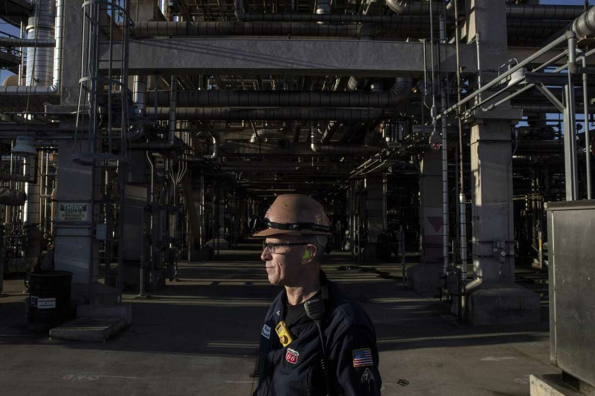 Brent Maxwell, Hydro-Cracker operator, stands near the newest upgrades that process biofuel instead of crude oil at the Phillips 66 refinery in Rodeo.