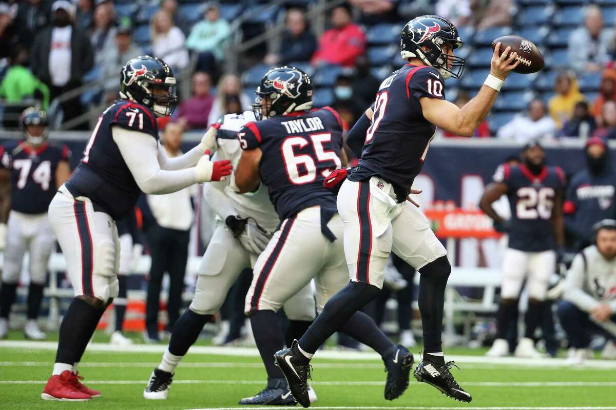 Houston Texans quarterback Davis Mills (10) scrambles out of the pocket against the Seattle Seahawks during the fourth quarter of an NFL football game Sunday, Dec. 12, 2021 in Houston.