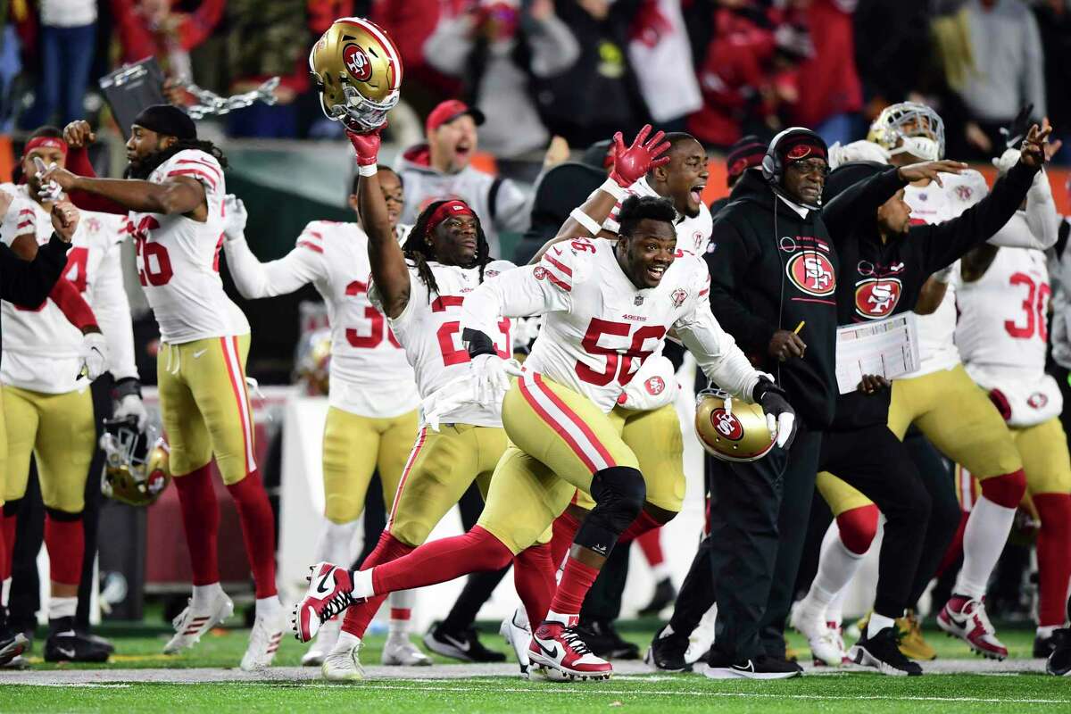 The San Francisco 49ers celebrate the game-winning touchdown in overtime during an NFL football game against the Cincinnati Bengals, Sunday, Dec. 12, 2021, in Cincinnati. (AP Photo/Emilee Chinn)