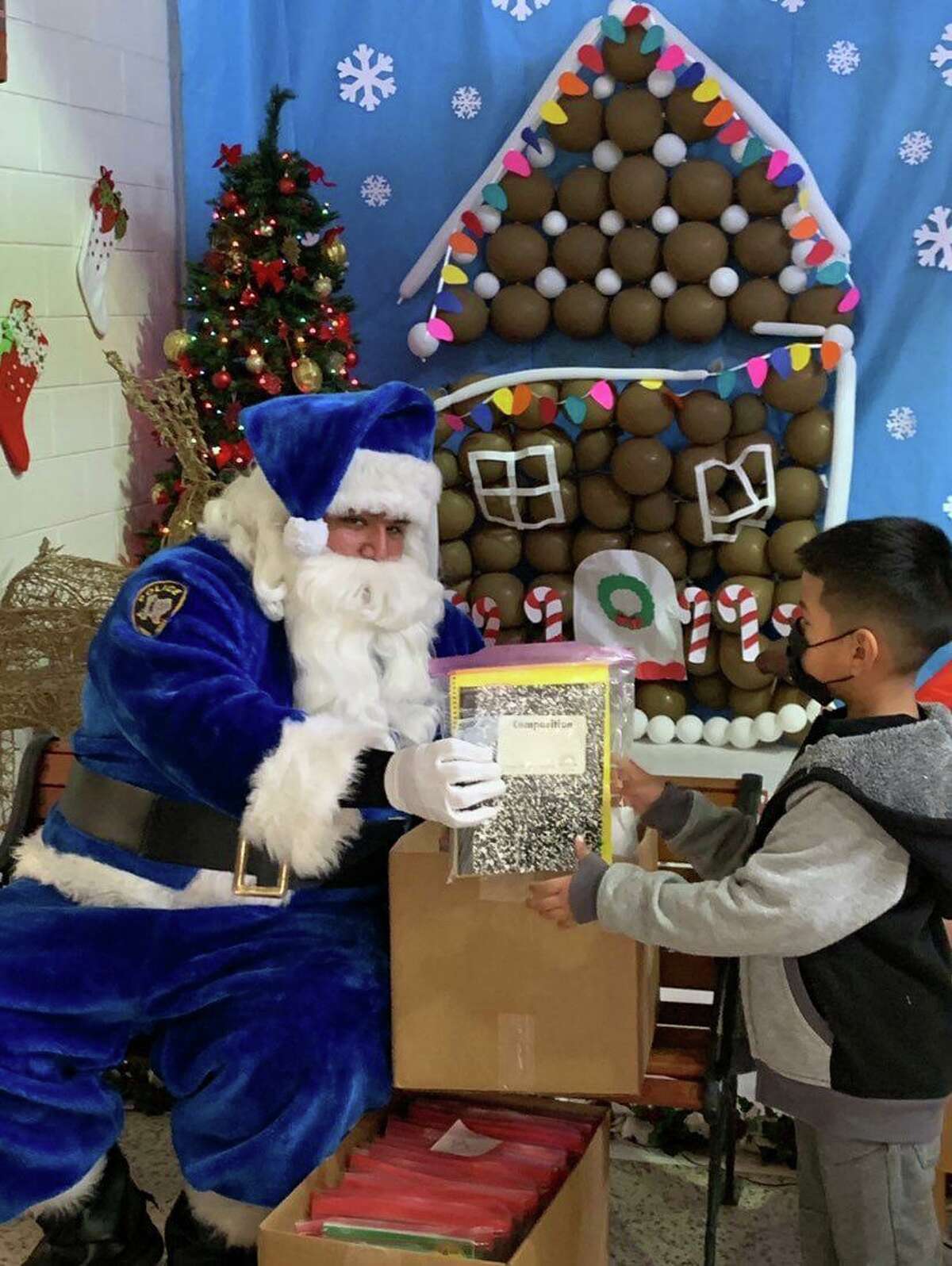 The LISD Police Department Blue Santa and the Texas National Guard visited Ligarde Elementary to deliver presents to the students.