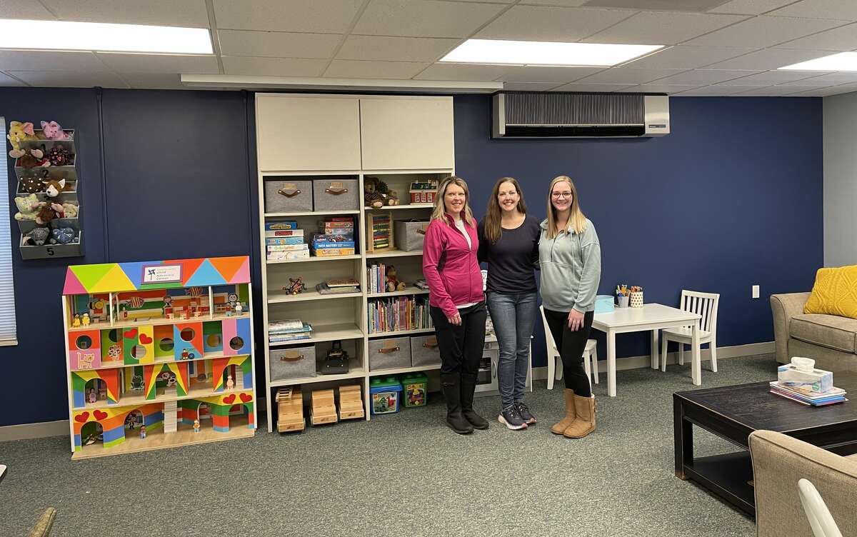 Child advocacy center staff members Traci Smith, Megan McCarthy and Chelsea Medacco stand in the center's intake room at the new location at 385 Third St., Suite B, next to the District Health Department #10 office. It has been renamed the Lakeshore Children's Advocacy Center.  