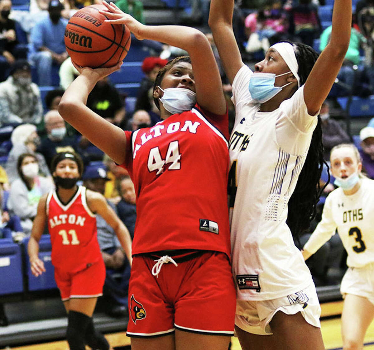 Alton's Jarius Powers (44) puts up a shot against O'Fallon's D'Myjah Bolds on Thursday at Panther Dome in O'Fallon.