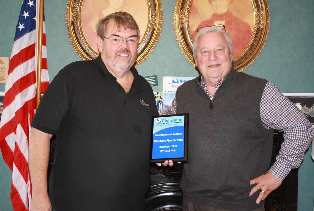 George McGilvrey of McGilvrey Fine Portraits in East Alton, left, receives the RiverBend Growth Association Small Business of the Month plaque from John Keller, RBGA President.