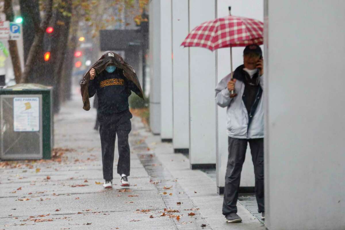 Heavy rains drench downtown in what meteorologists are calling an “atmospheric river” in Oakland, Calif. on Monday, Dec. 13, 2021.