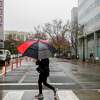 Heavy rains drench downtown in what meteorologists are calling an “atmospheric river” in Oakland, Calif. on Monday, Dec. 13, 2021.