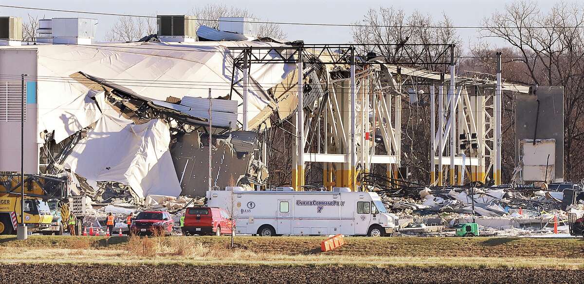 John Badman|The Telegraph The MABAS Unified Command Post remained set up Monday at the Edwardsville Amazon facility where six employees lost their lives in a tornado Friday night. By Monday morning workers had removed the last standing corner of the structure on the south end of the 1.1 million-square-foot building.
