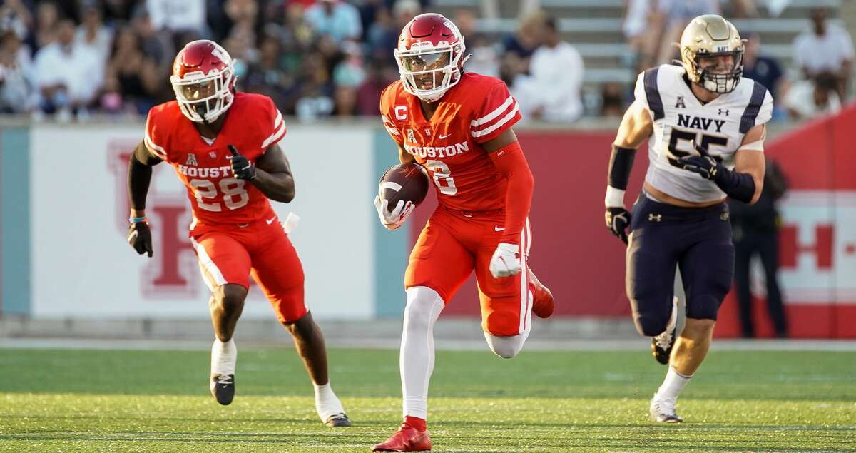 Houston Cougars cornerback Marcus Jones, returning a punt for a TD against Navy, will skip the Birmingham Bowl to prepare for the NFL draft.