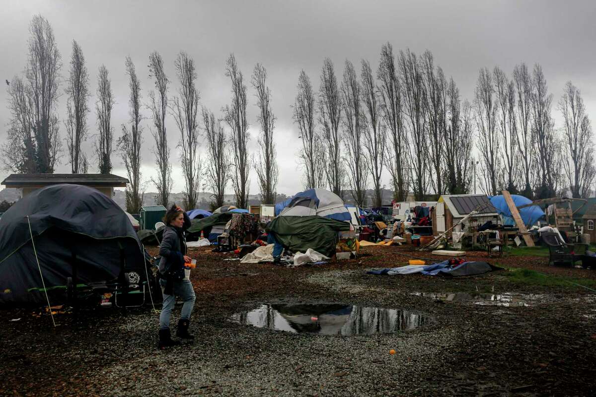 Puddles can be seen after heavy rains drenched a homeless encampment at Marinship in Sausalito, Calif. on Monday, Dec. 13, 2021.