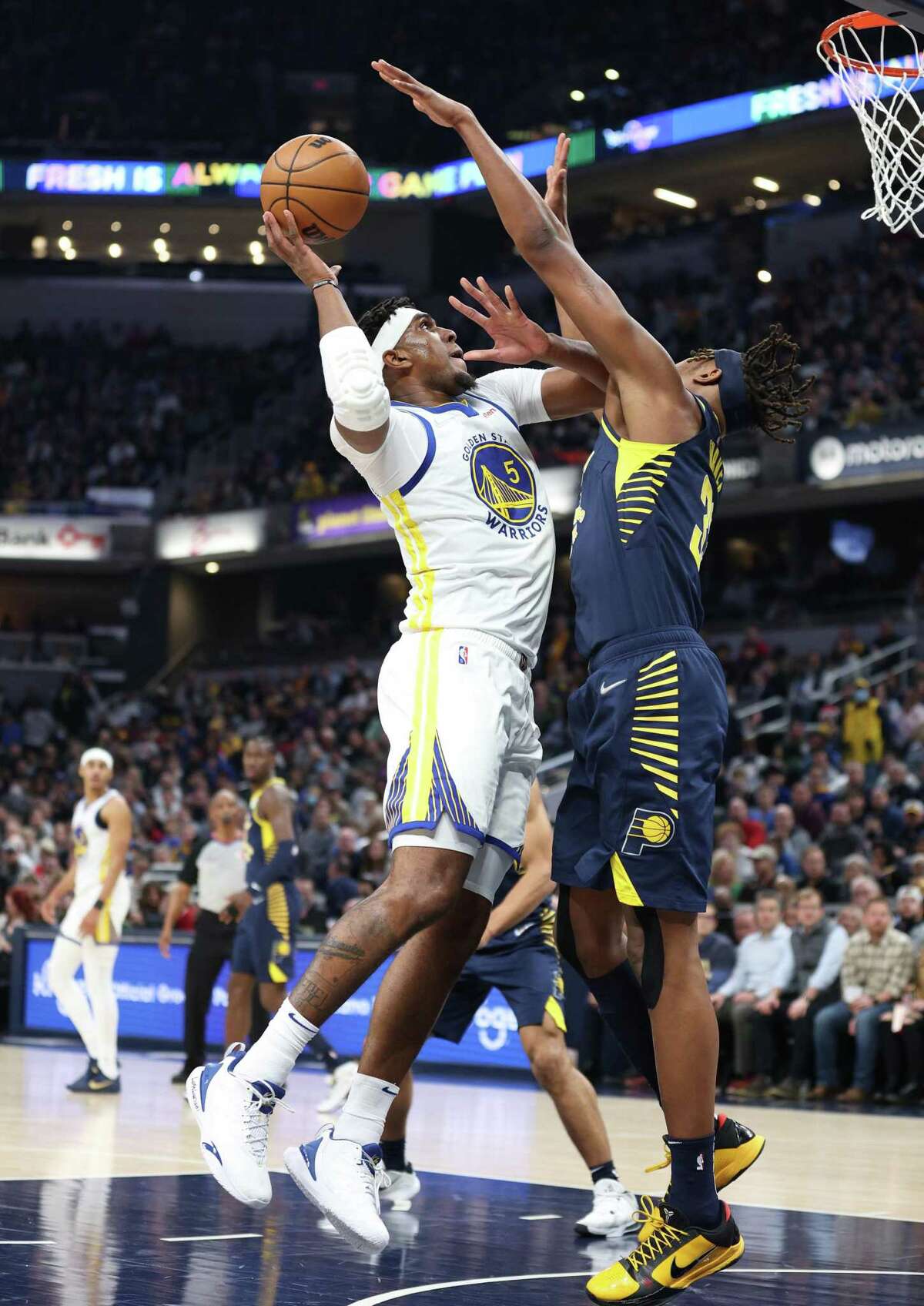 Kevon Looney #5 of the Golden State Warriors shoots the ball against the Indiana Pacers at Gainbridge Fieldhouse on December 13, 2021 in Indianapolis, Indiana.