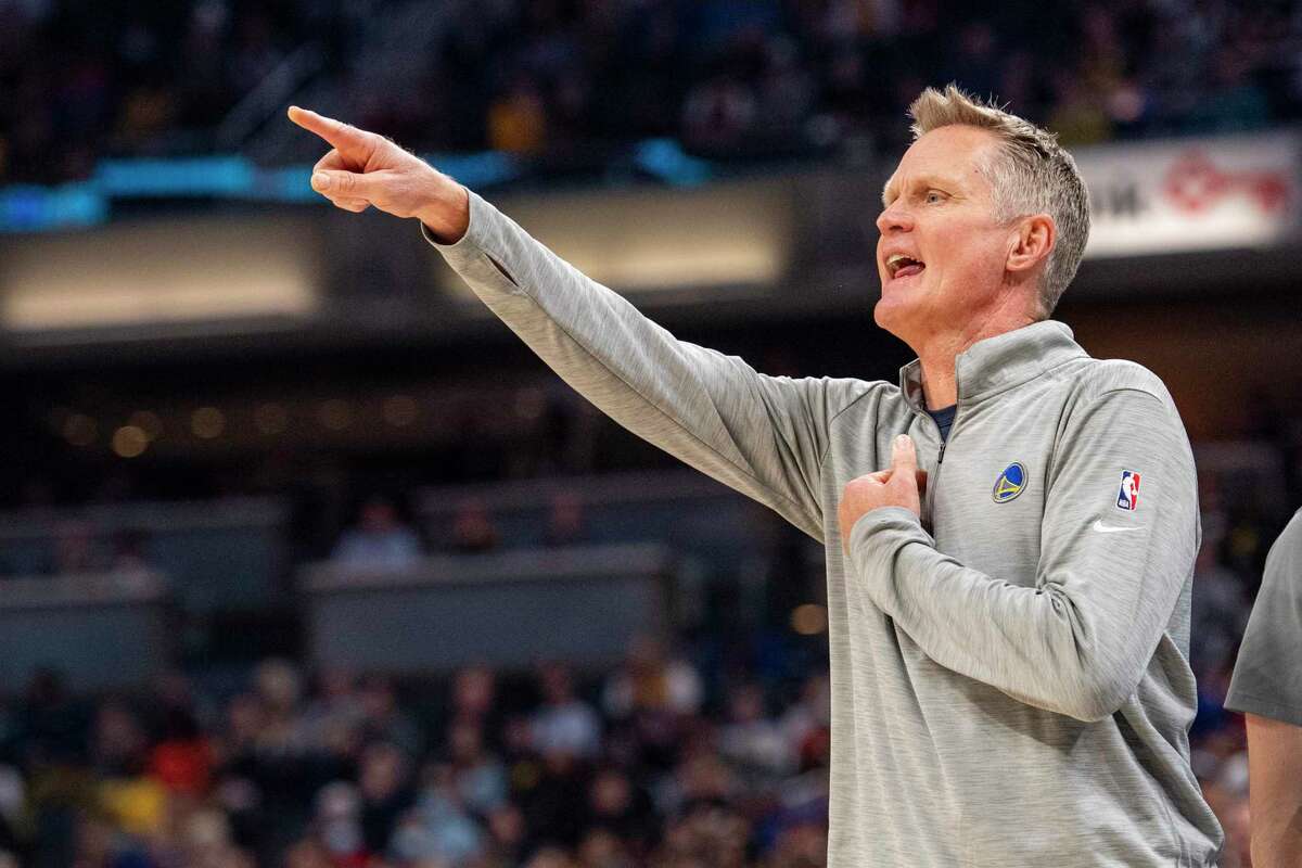Golden State Warriors head coach Steve Kerr reacts to action on the court during the first half of an NBA basketball game against the Indiana Pacers in Indianapolis, Monday, Dec. 13, 2021. (AP Photo/Doug McSchooler)