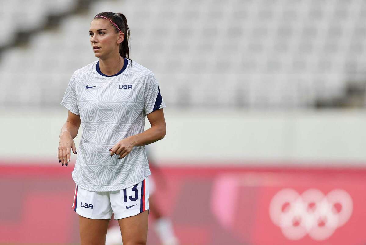 CHOFU, JAPAN - JULY 21: Alex Morgan #13 of Team United States looks on as they warm up prior to the Women's First Round Group G match between Sweden and United States during the Tokyo 2020 Olympic Games at Tokyo Stadium on July 21, 2021 in Chofu, Tokyo, Japan. (Photo by Dan Mullan/Getty Images)