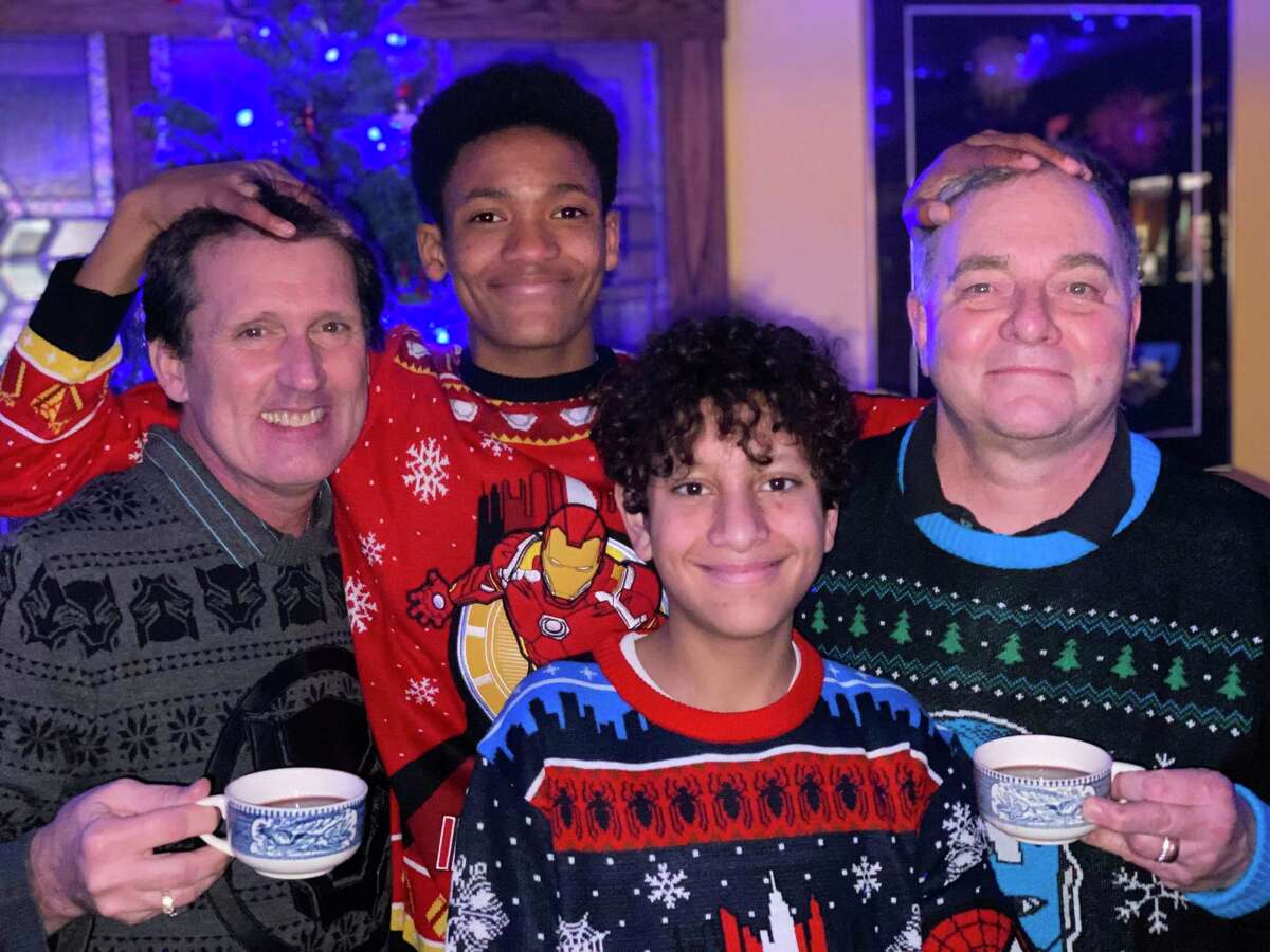 Brian, Zane, Aidan (not as tall as Kevin then) and Kevin Fisher-Paulson pose for their Christmas card photo in 2020.