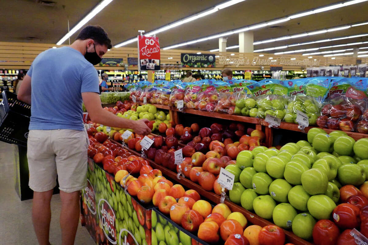 FILE - Customers shop for produce at a supermarket on June 10, 2021 in Chicago, Ill. (Photo by Scott Olson/Getty Images)