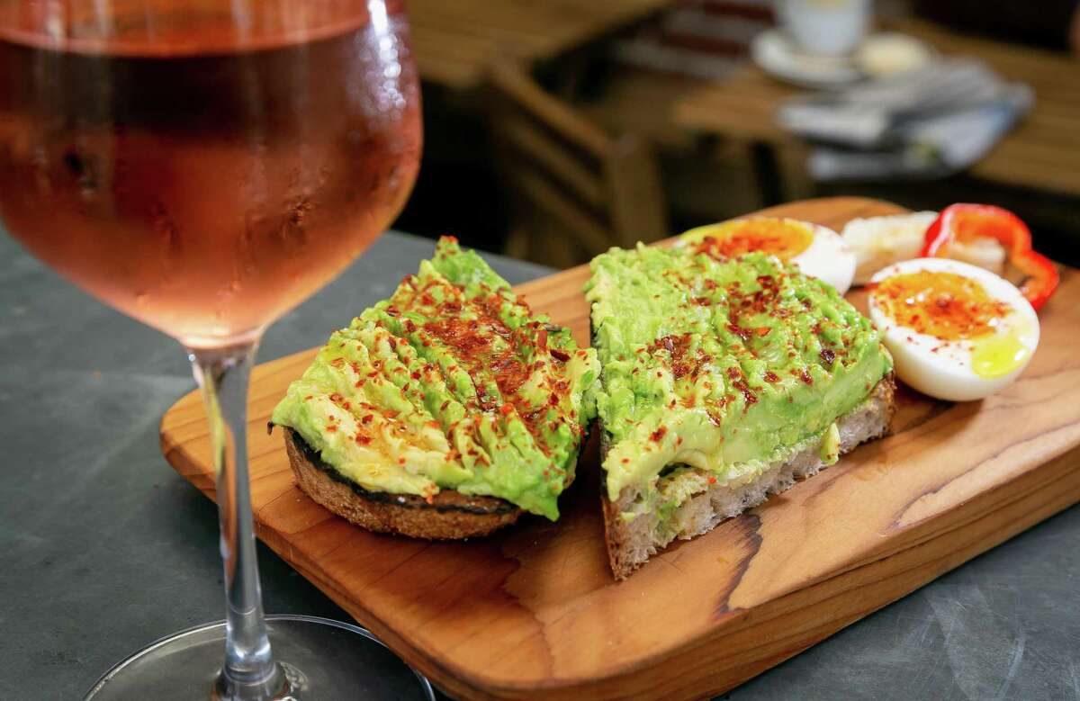 Avocado toast with a glass of rosé at Bartavelle Coffee and Wine Bar in Berkeley in 2018.