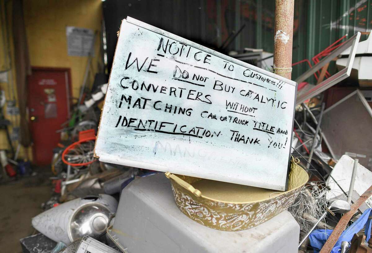 A prominently displayed sign warns potential sellers of catalytic converters about new requirements to make such transactions.