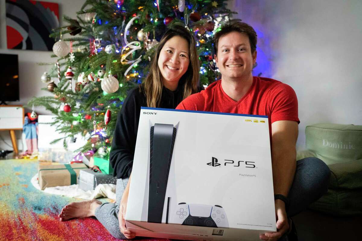 After striking out at several retailers over the course of weeks, Jennifer and Nicholaus Floyd were able to secure a Playstation 5 for their oldest son’s Christmas gift this year with a membership to Walmart and a Twitter tip-off on when the restock was dropping. The Playstation arrived on their doorstep on Friday and will be under the tree from Santa on Christmas morning. Photographed at their home, Monday, Dec. 13, 2021, in Houston.