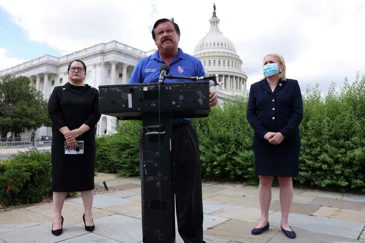 LULAC National President Domingo Garcia speaks as National CEO Sindy Benavides and U.S. Rep. Sylvia Garcia (D-TX) listen during a news conference July 10, 2020 on Capitol in Washington, DC.