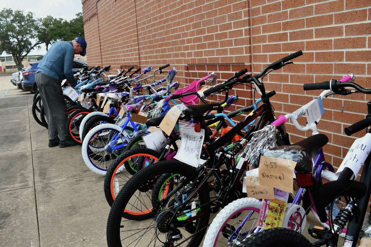 A volunteer with Santa's Sleigh tags bikes on Dec. 10, 2021.