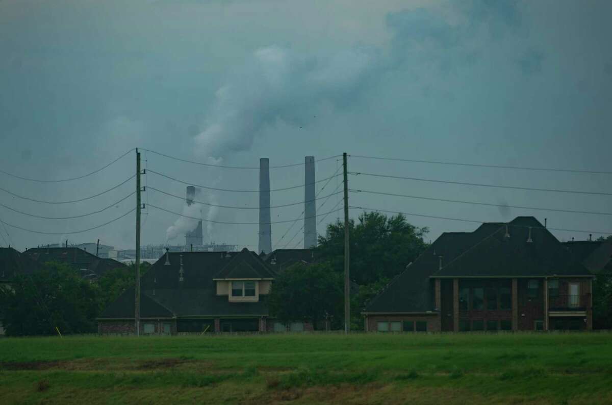 The WA Parish Generating Station can be seen south of homes in Sugar Land, Tuesday, June 29, 2021, in Fort Bend County.