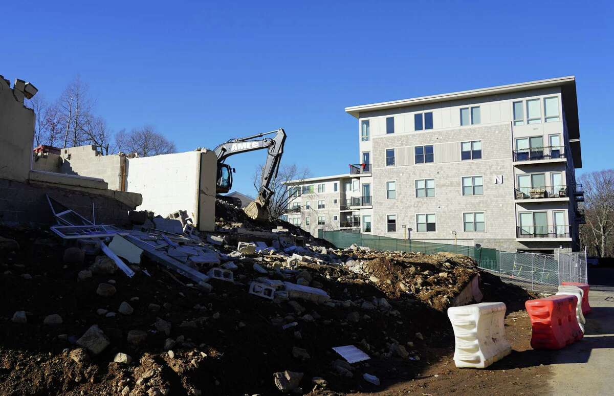 The old Canaan Parish buildings are being demolished to make room for the second affordable housing building on the corner of Route 123 and Lakeview Avenue in New Canaan on Dec. 13, 2021.
